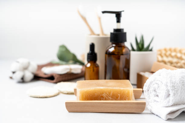 istock Natural bathroom and home spa tools. Zero waste sustainable lifestyle concept. Bamboo toothbrush, natural soap bar, cotton pads, homemade DIY beauty products in reusable bottles on white background 1324021949