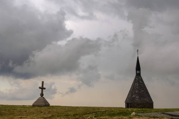 istock summit cross and a little chapel while hiking 1324022237