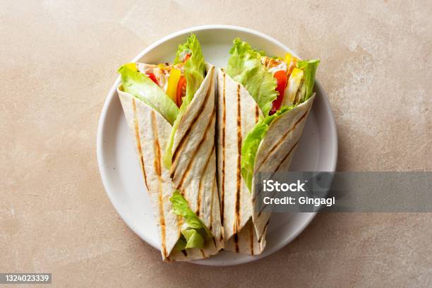 Wrap Burrito Sandwich Or Kebab With Flatbread With Vegetables And White Meat Delicious Healthy Food Take Away Snack Stock Photo - Download Image Now
