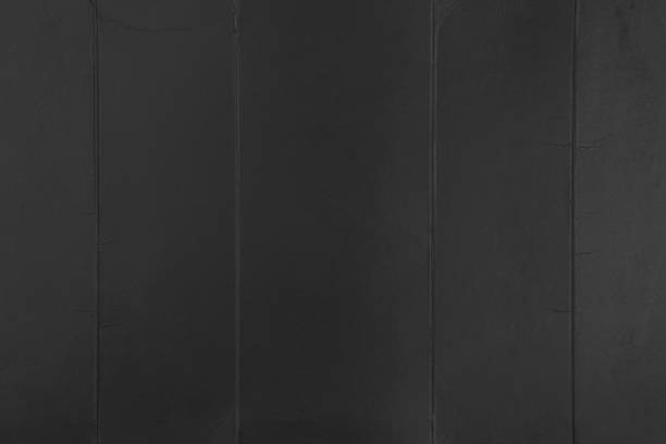 istock Black folded cardboard with rough folds. Texture old creased paper 1324025024