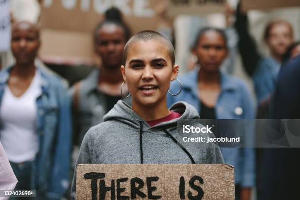 Woman Protesting On The City Street Stock Photo - Download Image Now - Protest, Climate Change, Multiracial Group