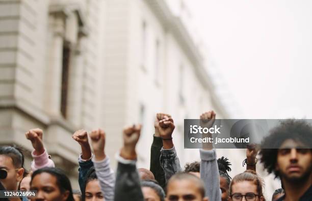 Arms Raised In Protest Stock Photo - Download Image Now - Protest, Fist, Black People