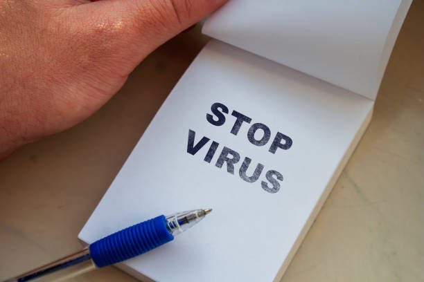 istock STOP VIRUS message on paper sheet note with pen. Goodbye coronavirus. Bye Bye pandemic life. New life with covid19 vaccine concept 1324027696