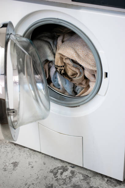 istock Delicate wool cloth laundry inside communal washing machine close up shot no people 1324027745