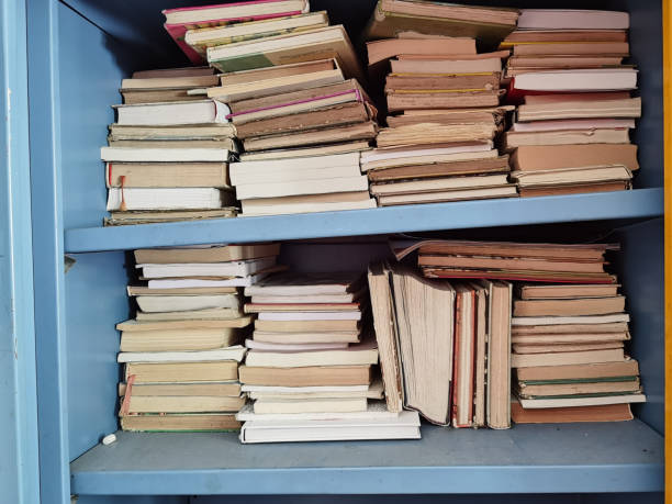 istock books book  old aged  in the dust pile stack isolated for background 1324030552
