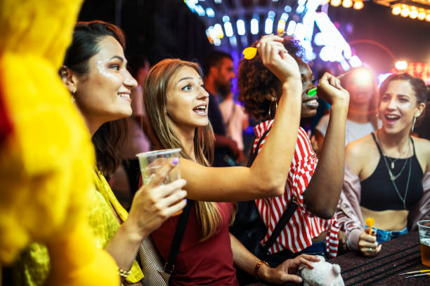 istock Friends enjoying in a amusement park 1324031155