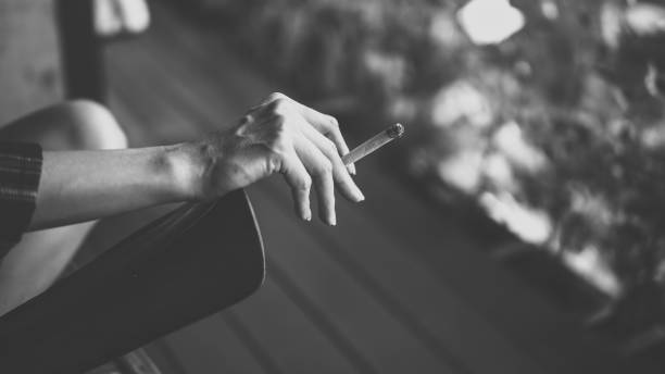 istock The cigarette in woman hand. 1324033586