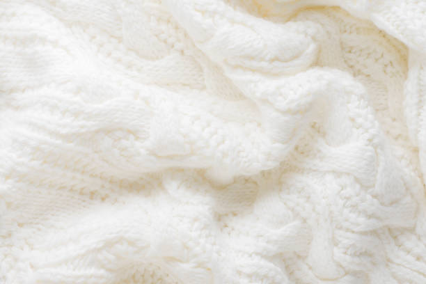 istock Knitted background of white winter sweater. 1324037705