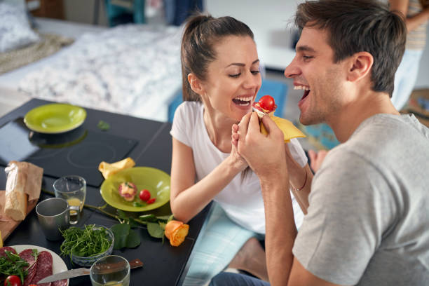 istock A young couple enjoys feeding each other while having a breakfast at home. Love, together, breakfast, home 1324038129