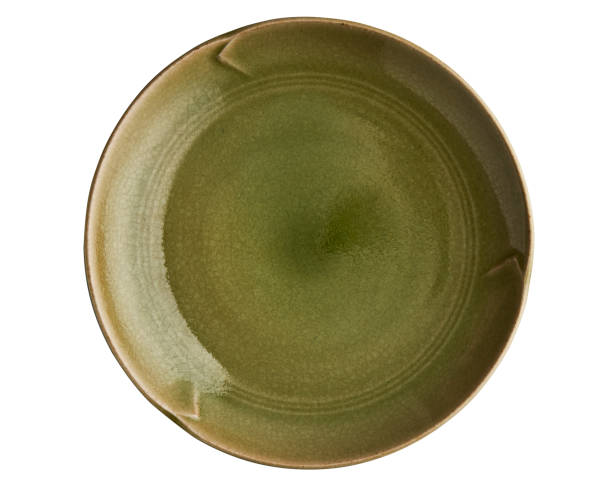 istock Green ceramic plate, Vintage ceramic plate, isolated on white background with clipping path, Top view 1324038139