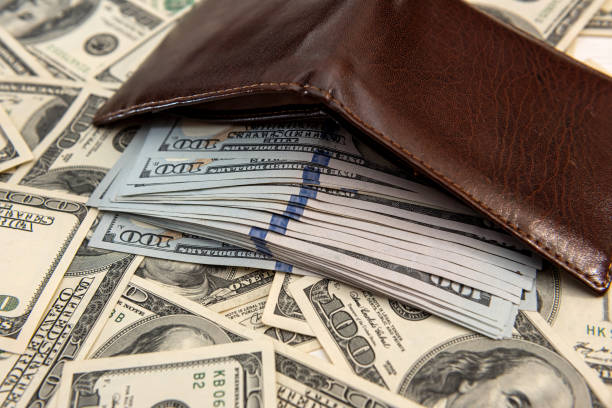 istock many U.S. dollars near man's wallet 1324038729