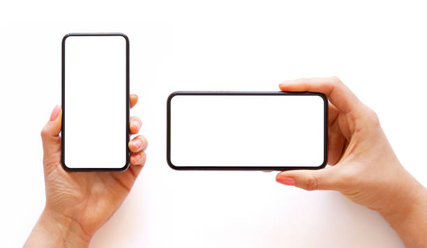 istock Mobile phone with empty white screen in hand in horizontal and vertical orientation, isolated on white background 1324038753