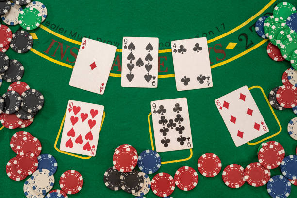 istock playing cards and casino poker chips on green table 1324039384