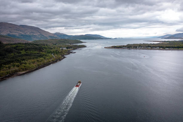 istock A Transporter Ship Motoring Next to the Coast 1324039621