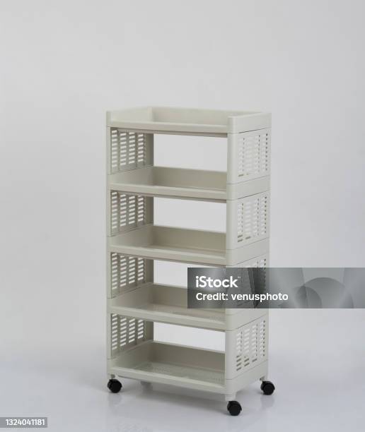 Empty White Plastic Shelves Rack With Wheels Isolated On White Stock ...