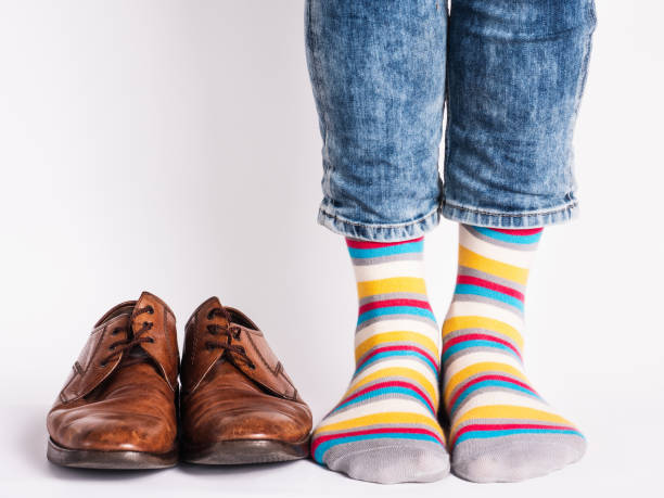 istock Men's legs, trendy shoes and bright socks 1324042348