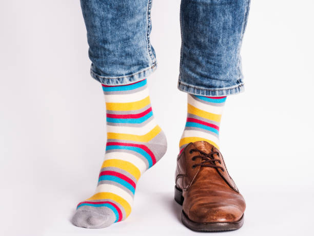 istock Men's legs, trendy shoes and bright socks 1324042580