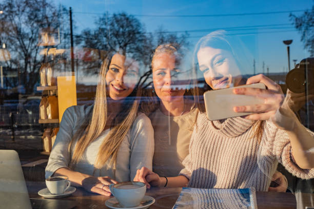 istock Three female friends taking a selfie whit mobile phone 1324044264