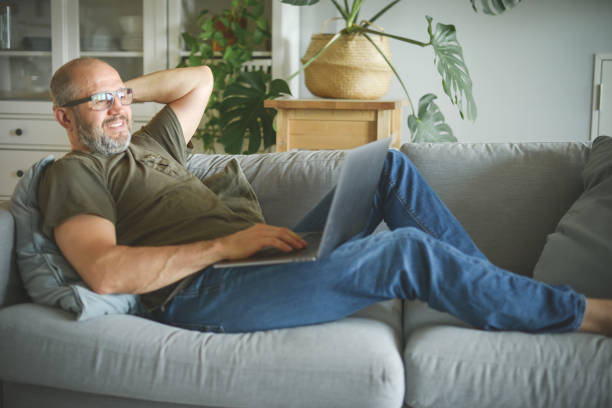 istock mature adult man working from home office ( with laptop) 1324044765