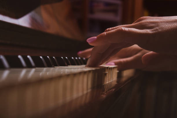 istock Girl and piano at home. Selective focus. 1324047005