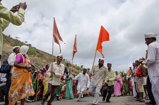 Dive Ghat, Pune, Maharashtra, India, During Pandharpur wari procession Pilgrims marching toward Vitthala temple with singing religious song with dancing.