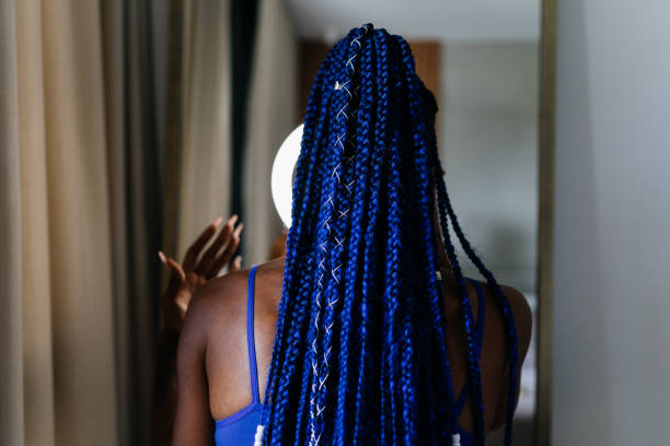 Rear view of trans woman with blue braid.