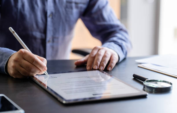 istock Man Signing The Digital Contract 1324053260