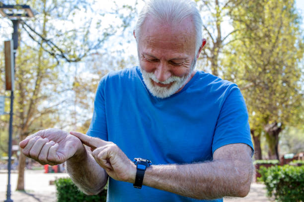 istock Senior man checking the time or his condition after training outdoors. 1324054239