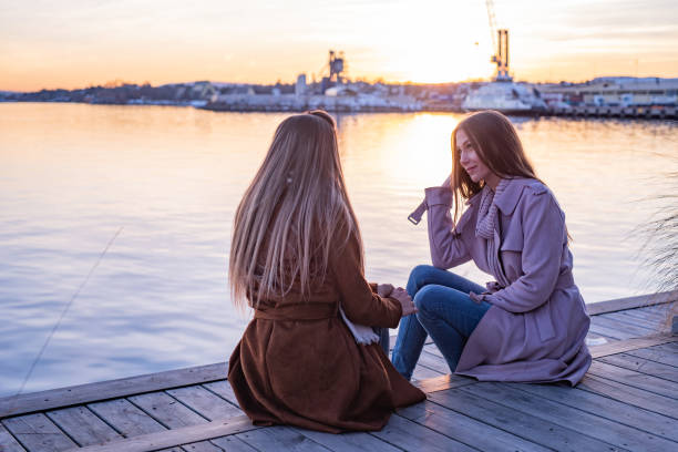 istock Two female friends talking outdoors 1324054257