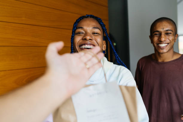 istock Smiling customers taking their order at home 1324055806