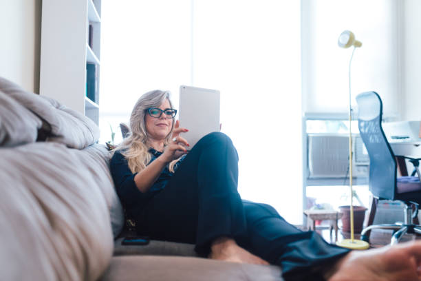 istock Woman using digital tablet at home 1324057181