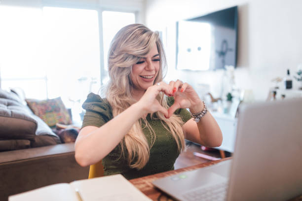 istock Sending love at video conference 1324057513