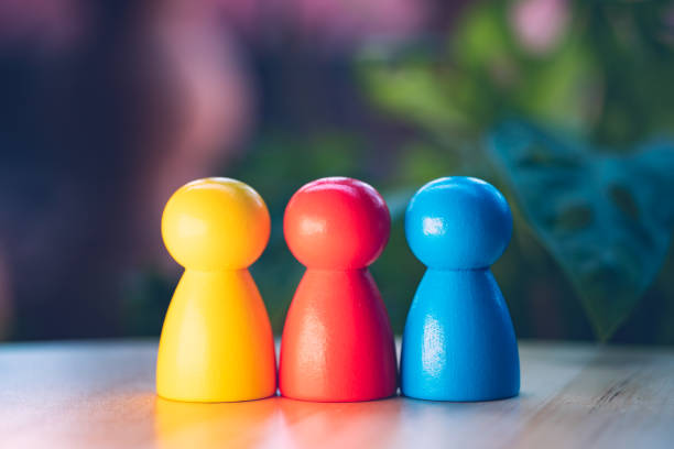 istock Closeup colorful wooden people on blurry background 1324057639