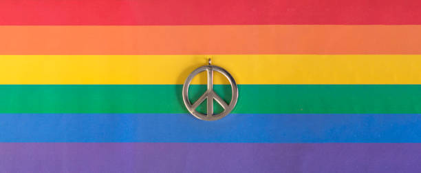 simbolo di pace su una bandiera arcobaleno lgbtqia - symbols of peace flag gay pride flag banner foto e immagini stock