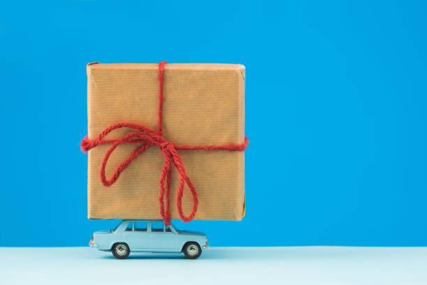 istock Delivery package concept, old toy cars deliver gift 1324062321