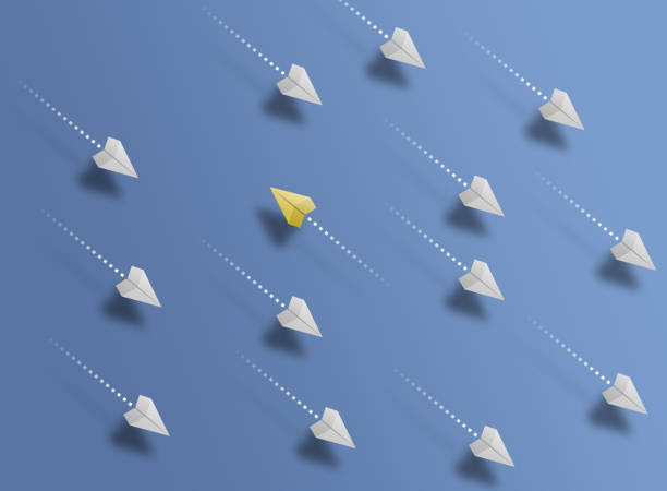 istock group of paper planes flying in one direction on blue background and one paper glider going in different or opposite direction 1324063338