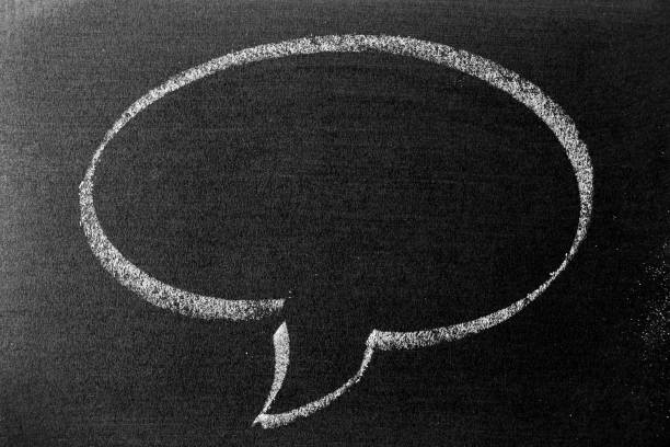 istock White color chalk hand drawing in round bubble speech shape with blank space on blackboard or chalkboard background 1324063850