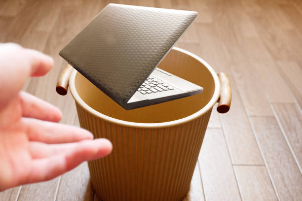 istock Throw a thick, heavy old laptop into the trash 1324065089
