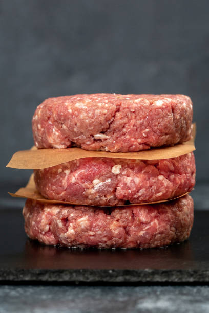 istock Minced beef meat for burger on black background 1324068126