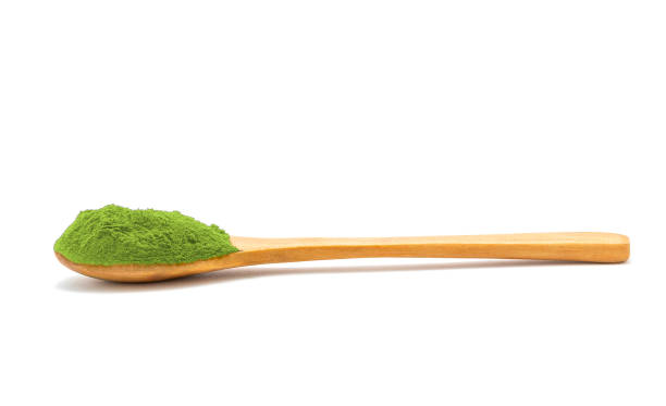 istock Powder in wooden spoon on white background 1324068297