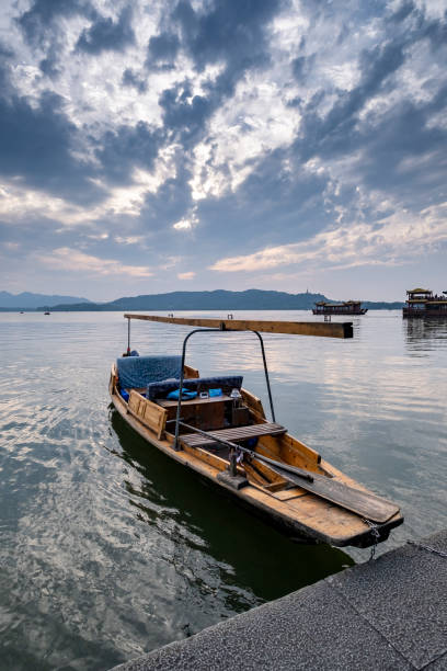 istock Rowing boat under the magic sky, West Lake, Hangzhou, China 1324069086