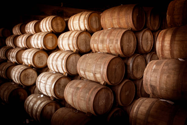 istock Wine barrels stacked in the old cellar. 1324069502