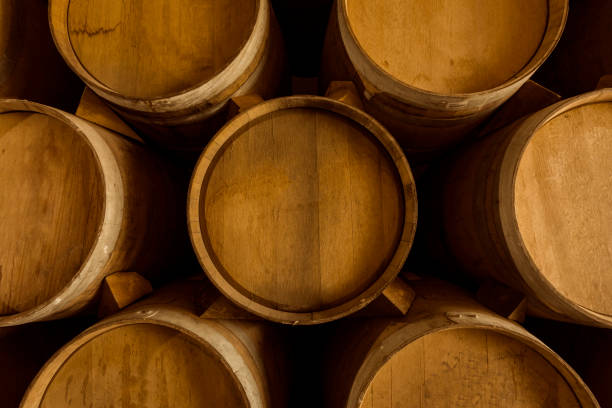 istock Wine barrels stacked in the old cellar. 1324069581