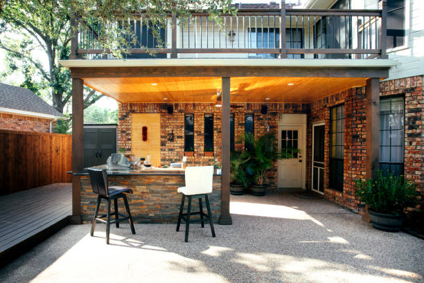 istock New and modern outdoor kitchen on a sunny summer evening, dinner preparation 1324069589