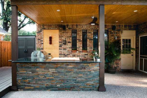 istock New and modern outdoor kitchen on a sunny summer evening, dinner preparation 1324069595