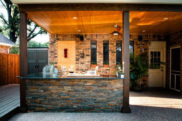 istock New and modern outdoor kitchen on a sunny summer evening, dinner preparation 1324069596