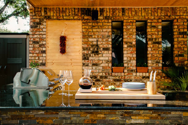 istock New and modern outdoor kitchen on a sunny summer evening, dinner preparation 1324069668