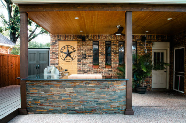 istock New and modern outdoor kitchen on a sunny summer evening, dinner preparation 1324069672