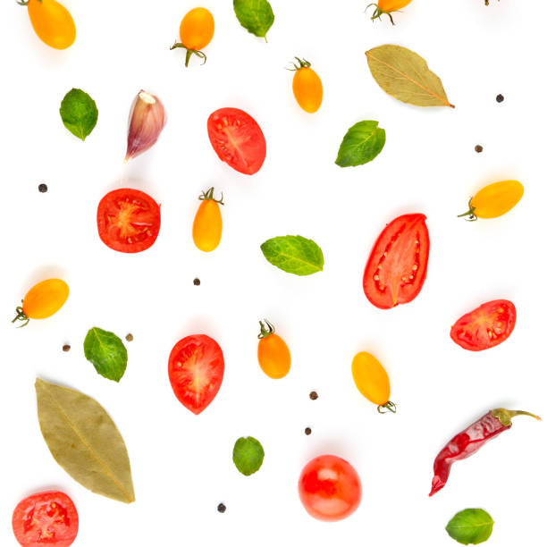 istock Cherry tomatoes and spices isolated on white background. 1324072475