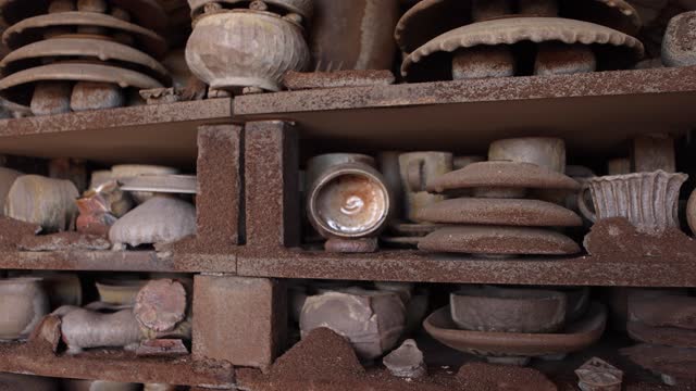 Close Up of Stacks of Pottery in Kiln